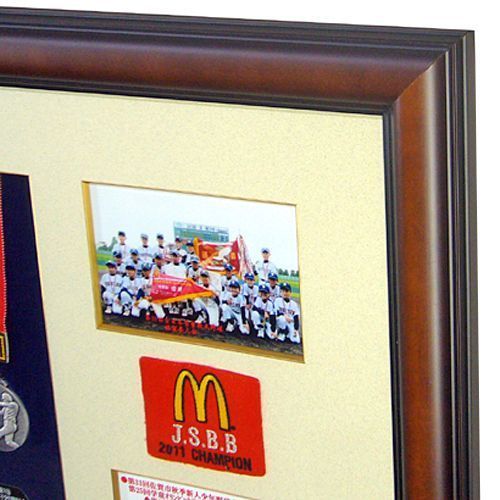 少年野球のメダルと写真